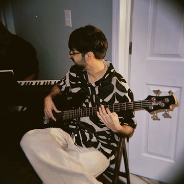 Rudransh playing bass in his home studio